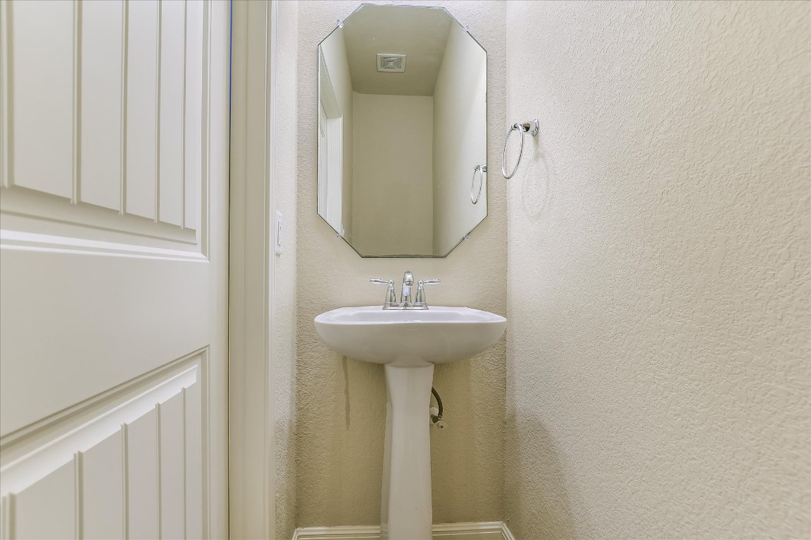 14001 Avery Ranch Boulevard, Unit 2104 Austin, TX 78717 - Photo 18 of 20 a bathroom with a sink and a mirror