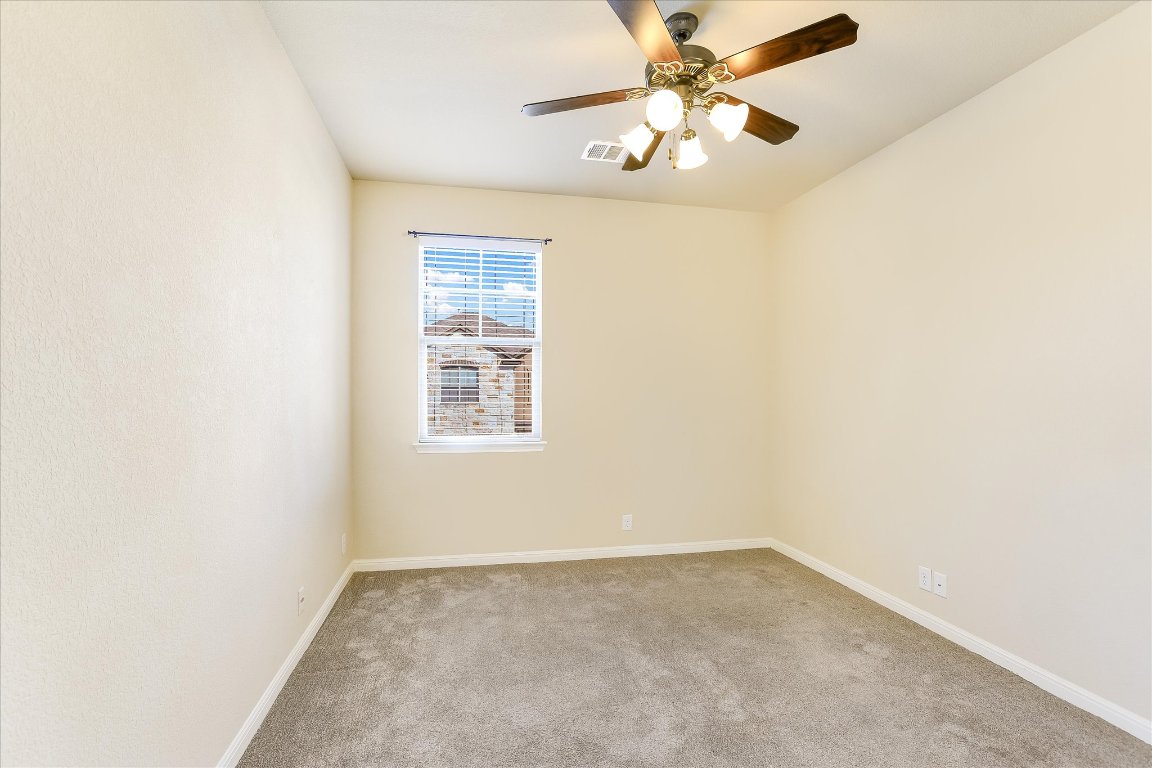 14001 Avery Ranch Boulevard, Unit 2104 Austin, TX 78717 - Photo 18 of 21 an empty room with a window and a fan