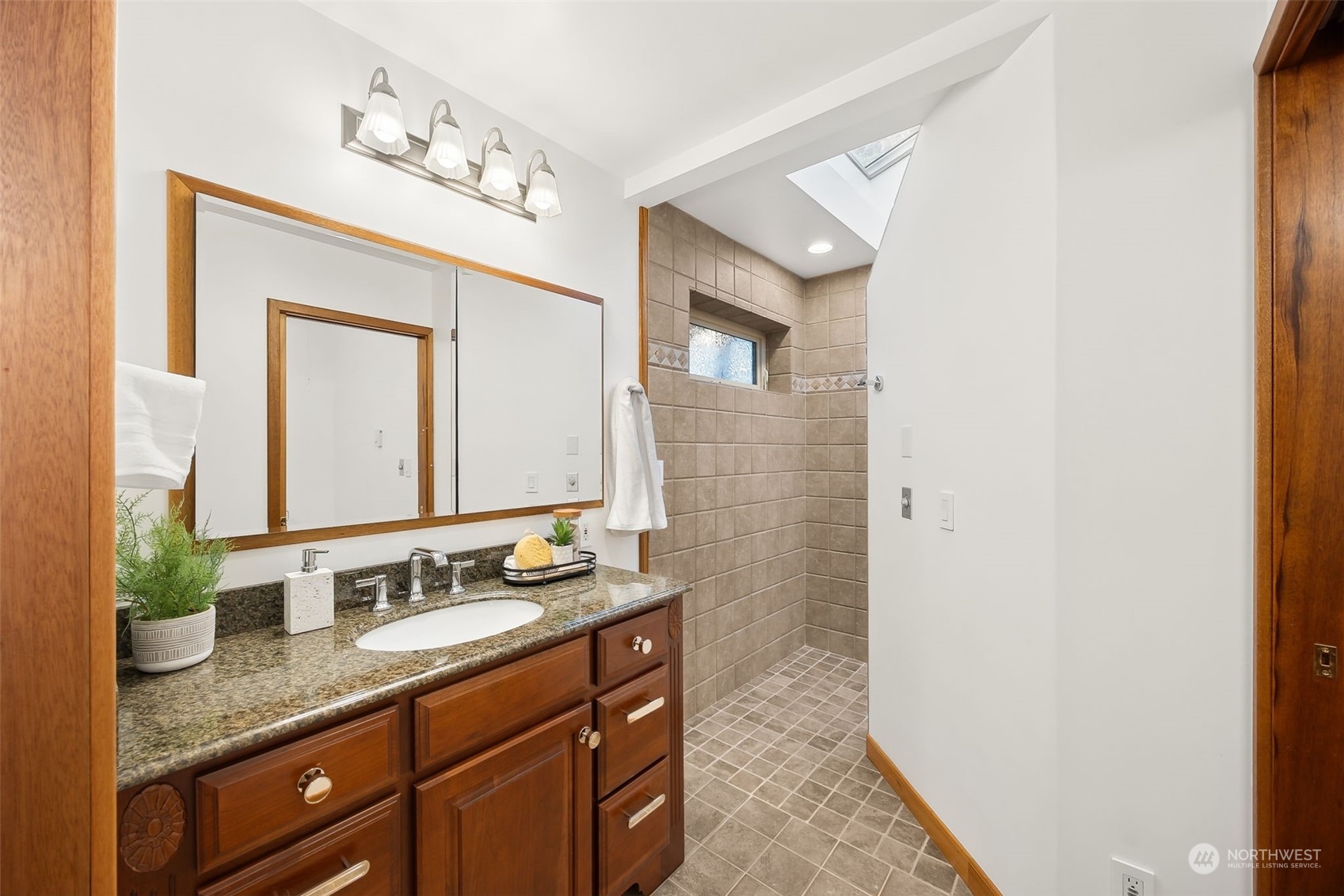 29011 7th Place South Federal Way, WA 98003 - Photo 19 of 40 a bathroom with a granite countertop sink and a mirror