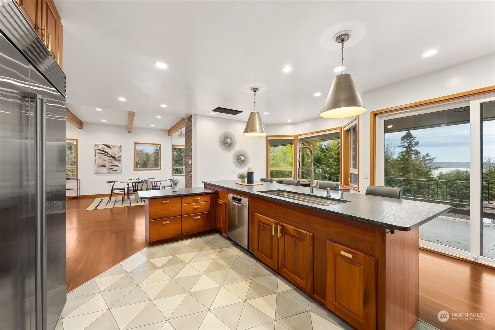 29011 7th Place South Federal Way, WA 98003 - Photo 5 of 40 a large kitchen with kitchen island granite countertop a large counter top stainless steel appliances a large window and cabinets