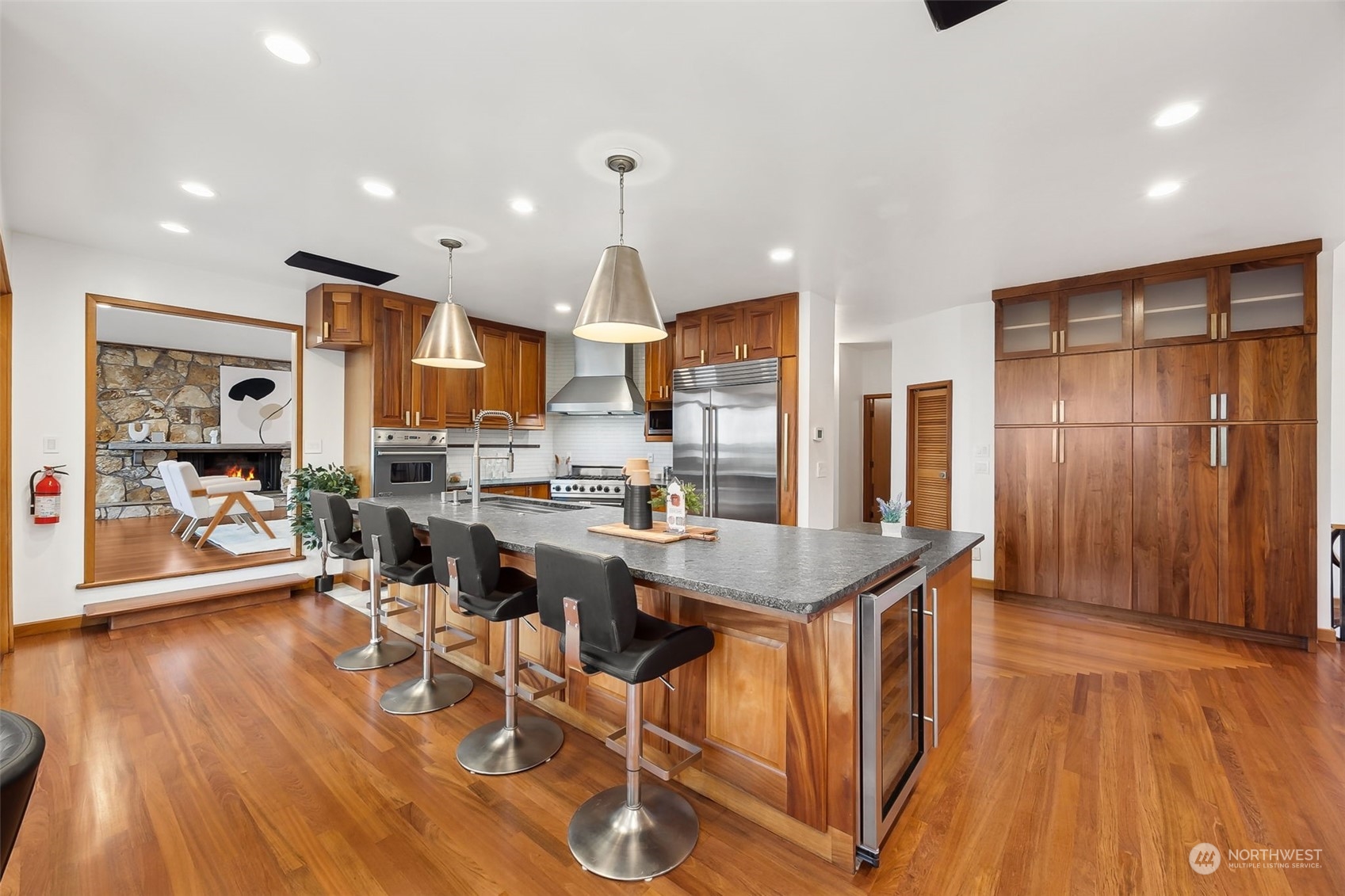 29011 7th Place South Federal Way, WA 98003 - Photo 6 of 40 a dining room with stainless steel appliances granite countertop a table chairs and a refrigerator