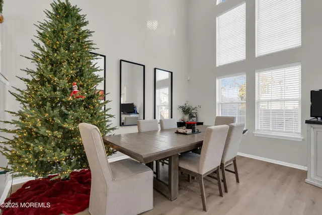 a kitchen with granite countertop wooden cabinets a stove top oven and stainless steel appliances