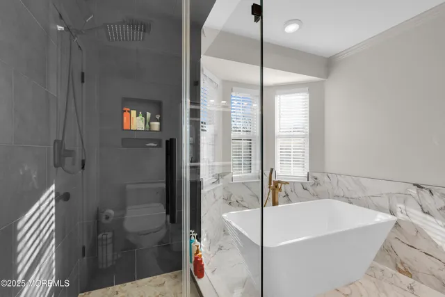 a kitchen with a sink a stove and cabinets