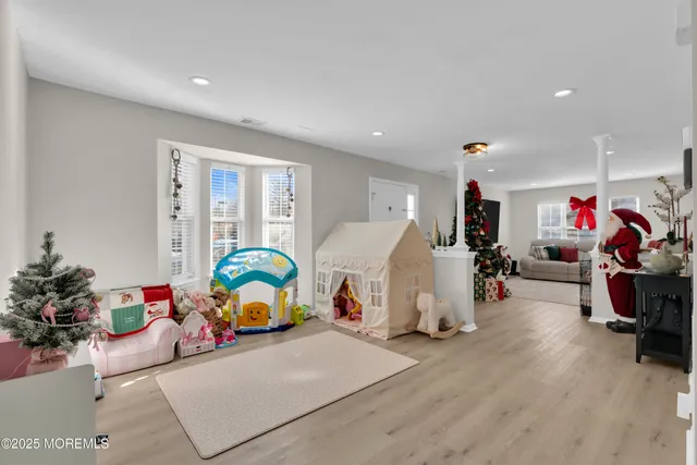 a children room with furniture and a window
