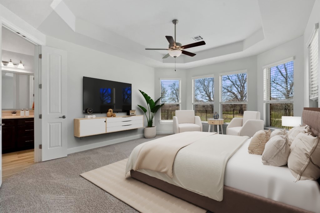 5152 Cornetto Bluffs Round Rock, TX 78665 - Photo 19 of 36 a bedroom with a large bed and a flat screen tv