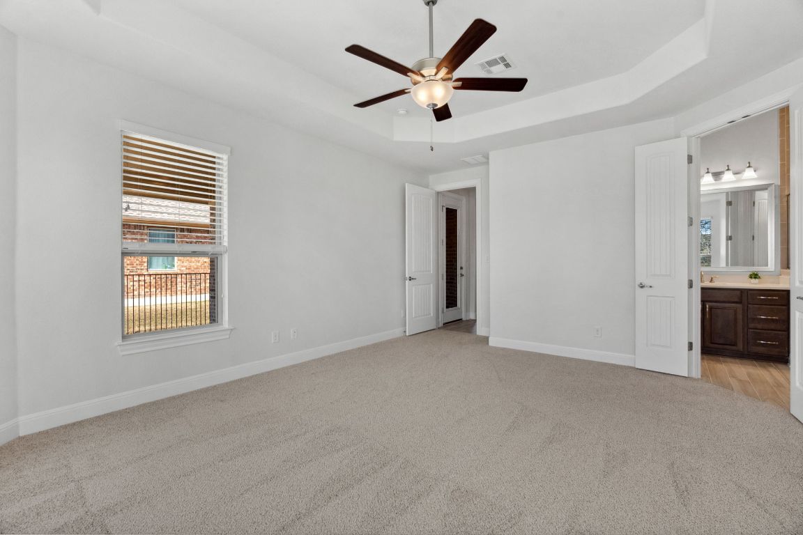5152 Cornetto Bluffs Round Rock, TX 78665 - Photo 21 of 36 a view of a livingroom with a ceiling fan and window