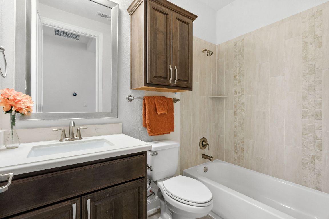 5152 Cornetto Bluffs Round Rock, TX 78665 - Photo 27 of 36 a bathroom with a sink a toilet and shower