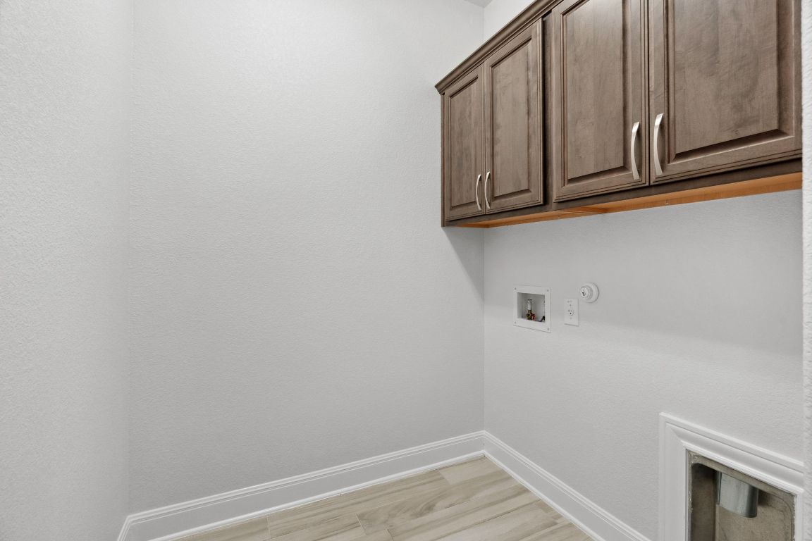 5152 Cornetto Bluffs Round Rock, TX 78665 - Photo 28 of 36 a view of a microwave and cabinets