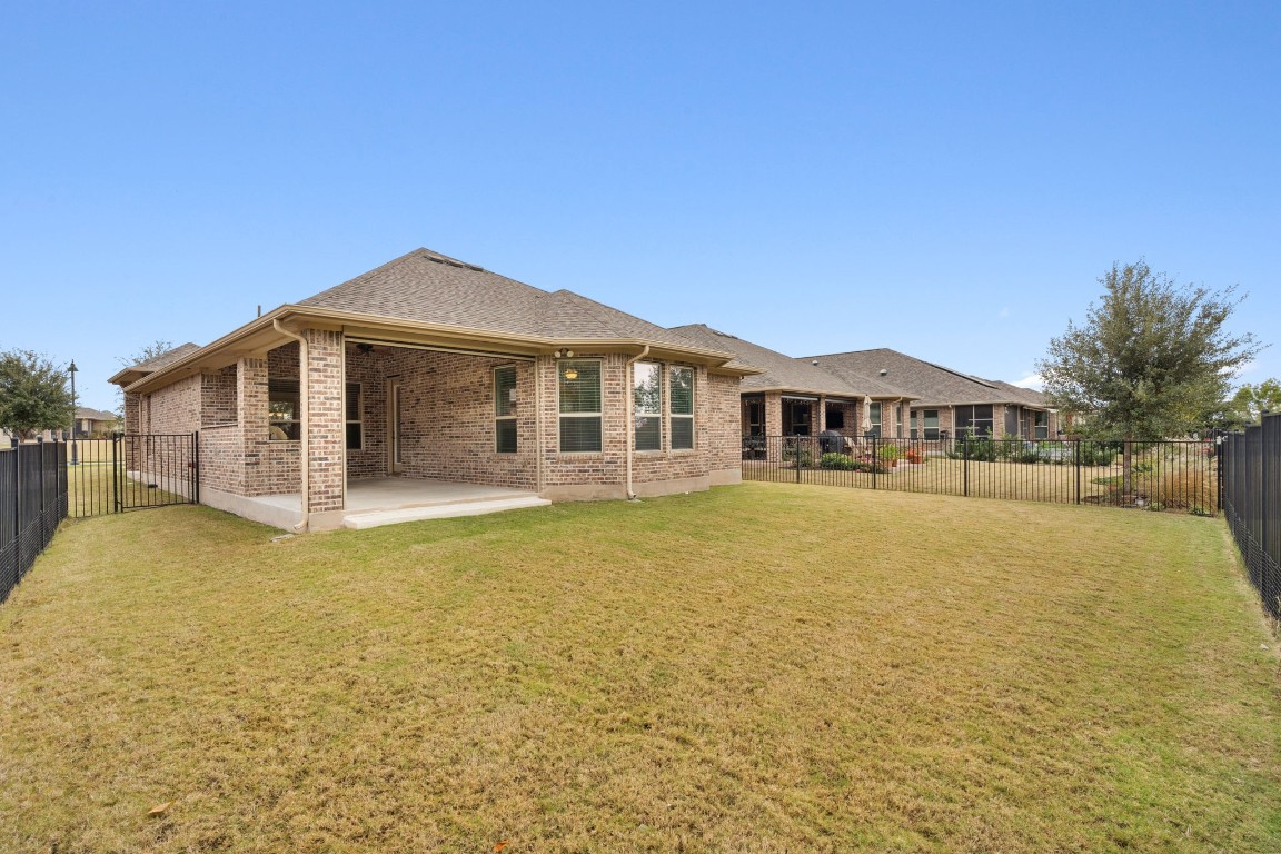 5152 Cornetto Bluffs Round Rock, TX 78665 - Photo 29 of 36 a front view of a house with a yard