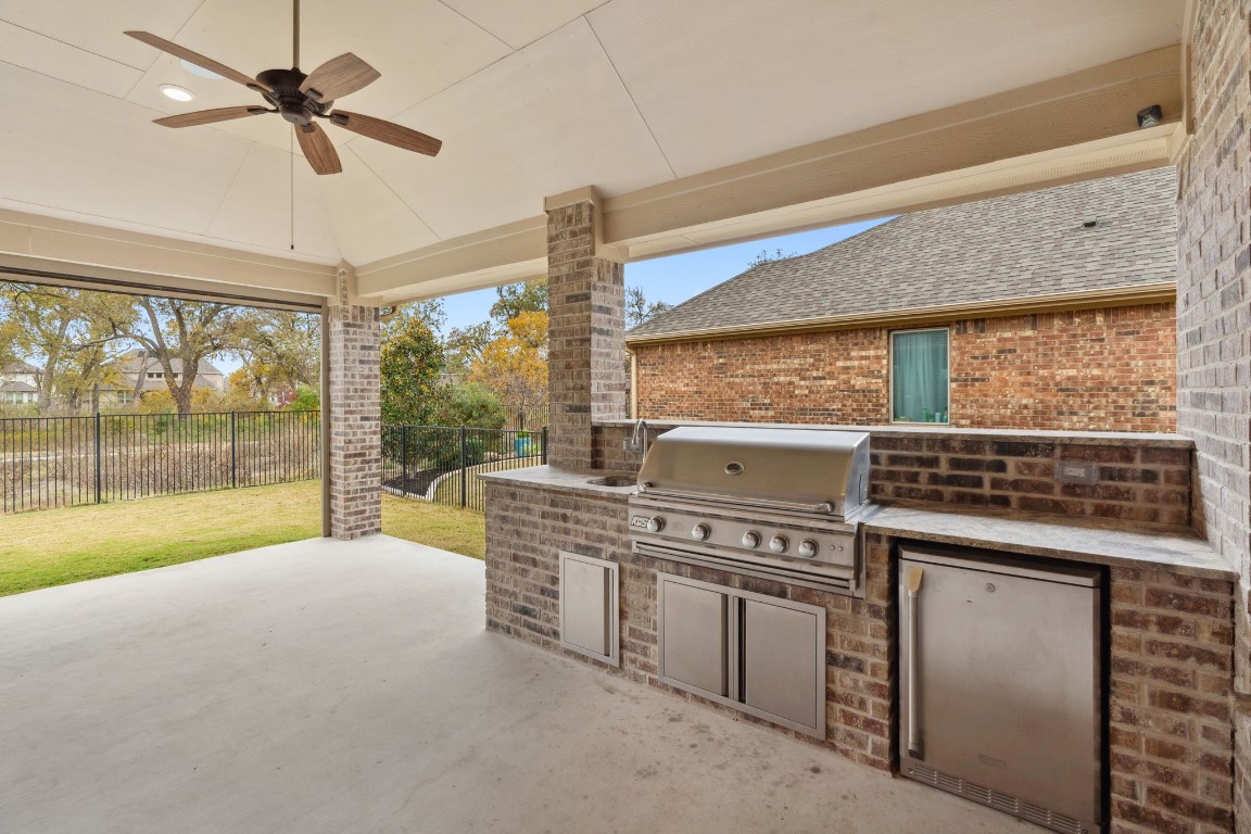 5152 Cornetto Bluffs Round Rock, TX 78665 - Photo 30 of 36 a kitchen with a stove and a view of living room