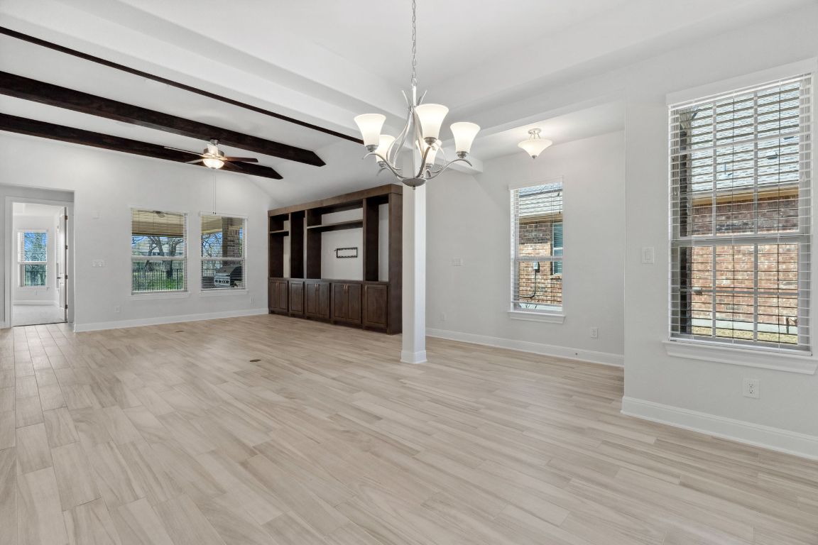 5152 Cornetto Bluffs Round Rock, TX 78665 - Photo 6 of 36 a view of an empty room with a window and wooden floor