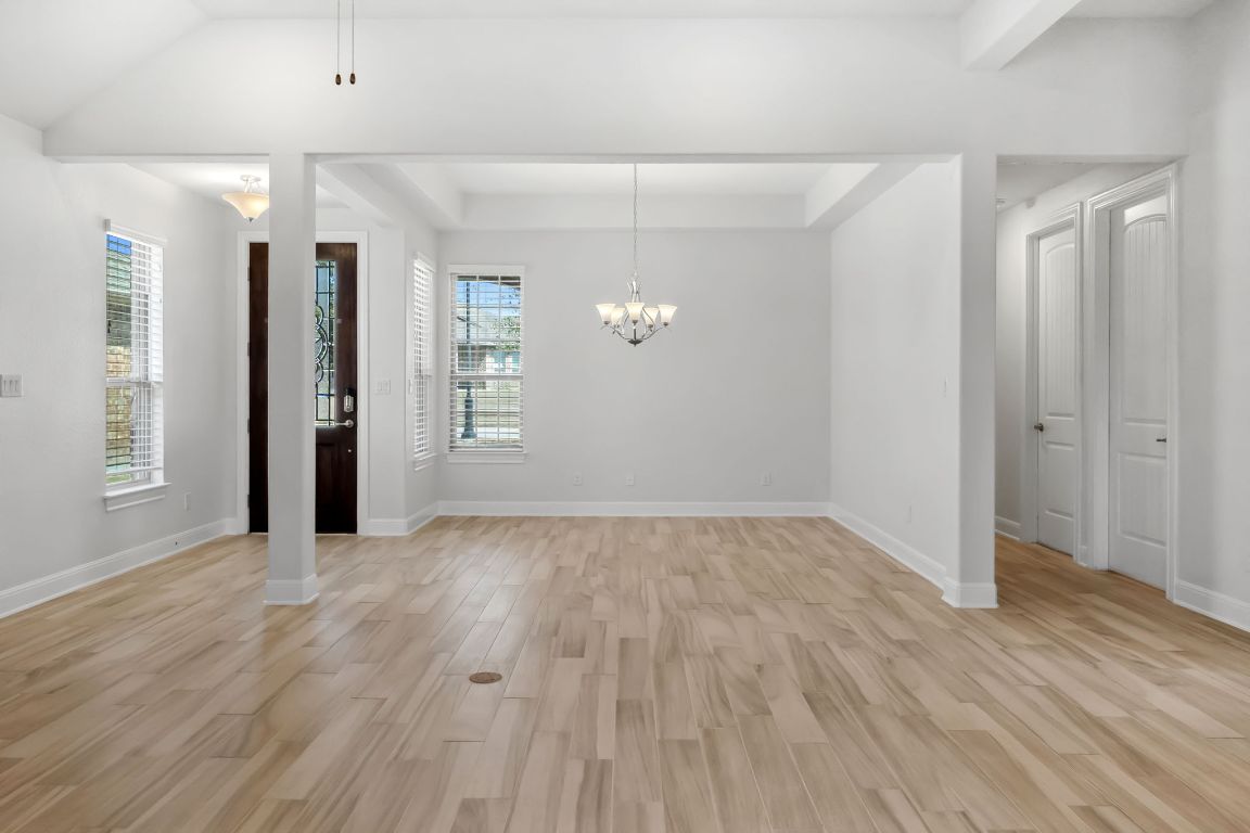 5152 Cornetto Bluffs Round Rock, TX 78665 - Photo 9 of 36 wooden floor in an empty room with a window