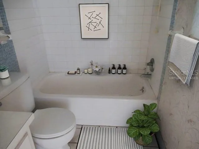 a bathroom with a bathtub and a toilet