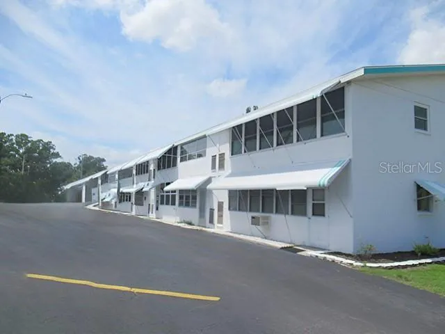 a view of a house with swimming pool