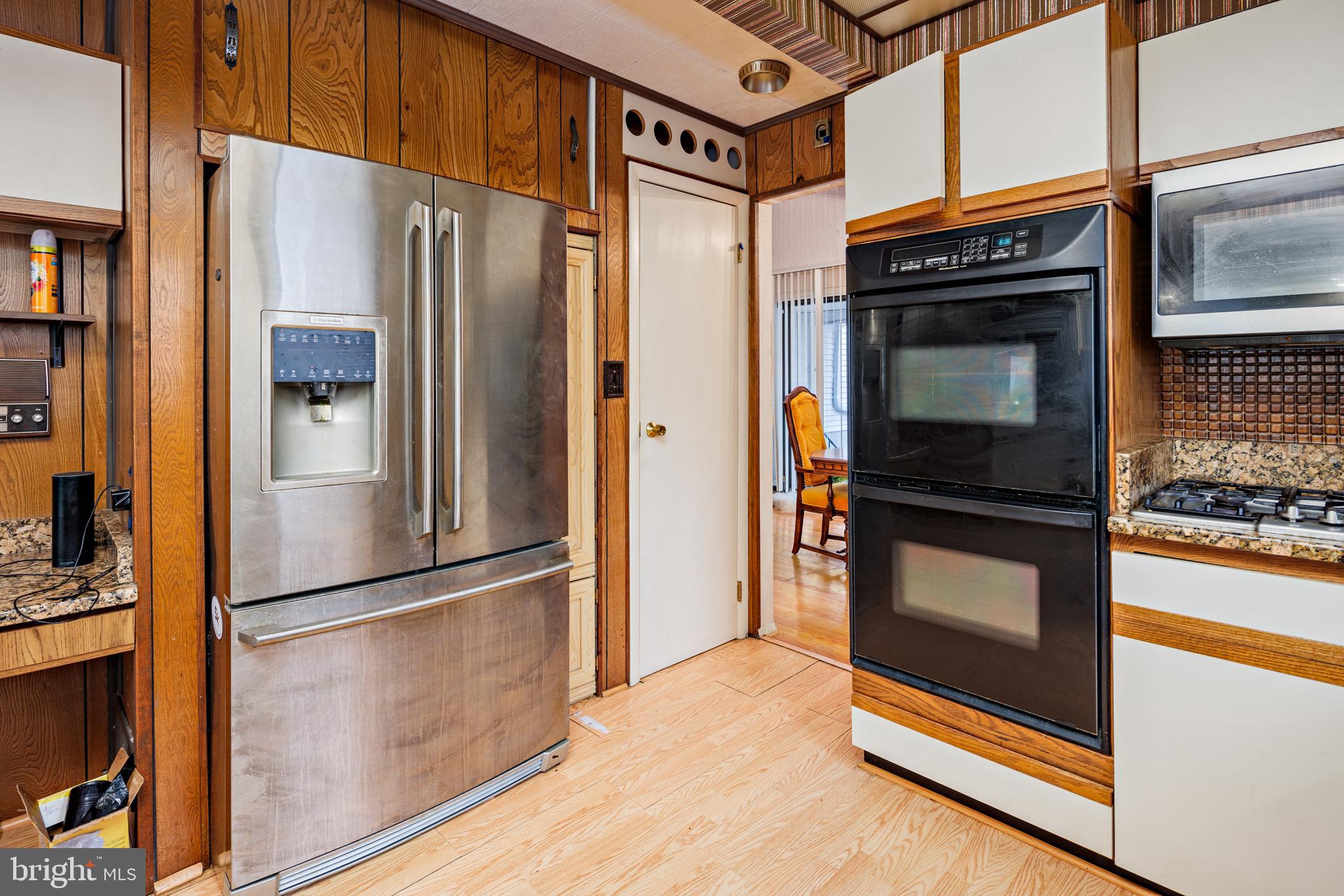 3819 Janbrook Road Randallstown, MD 21133 - Photo 11 of 47 a kitchen with stainless steel appliances a refrigerator and a stove top oven