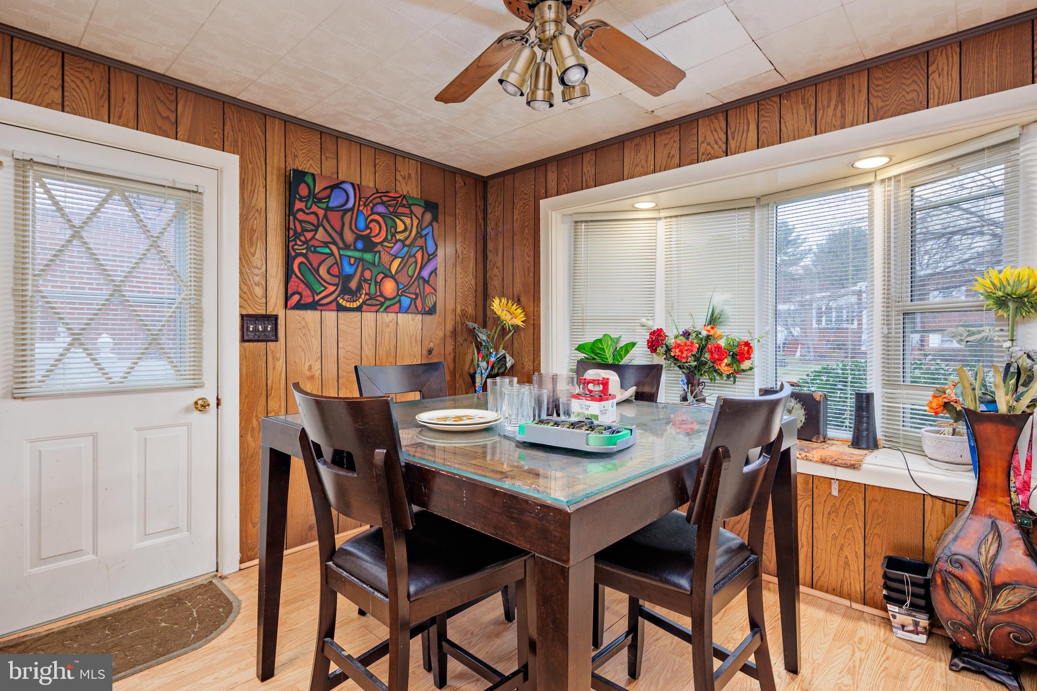 3819 Janbrook Road Randallstown, MD 21133 - Photo 12 of 47 a view of a dining room with furniture and wooden floor