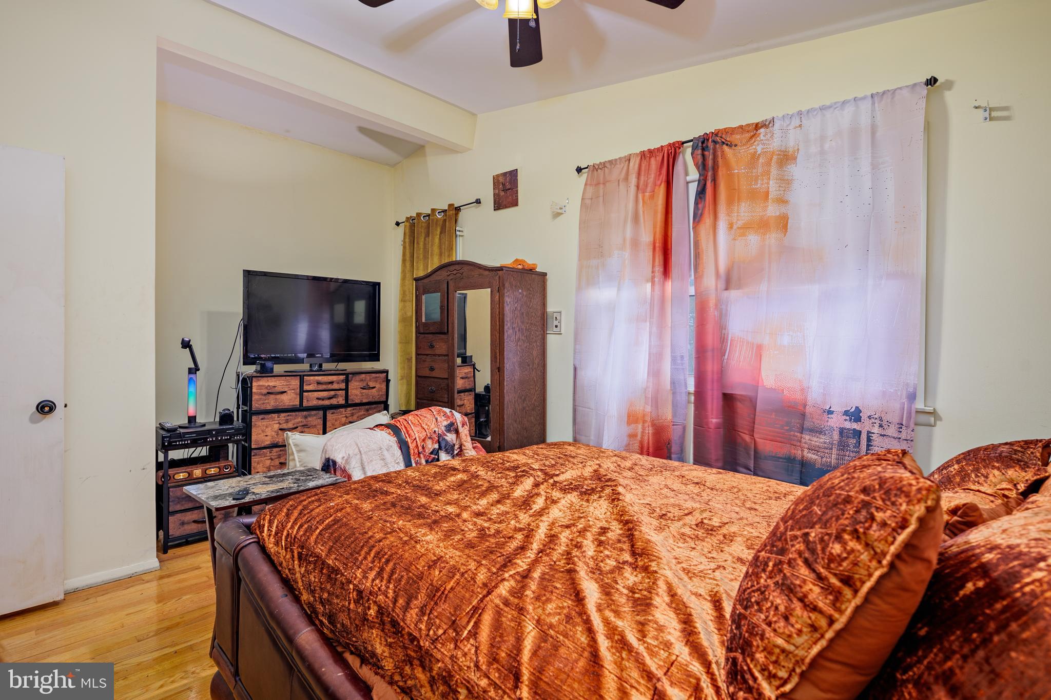 3819 Janbrook Road Randallstown, MD 21133 - Photo 22 of 47 a bedroom with a bed and a flat tv screen on dresser