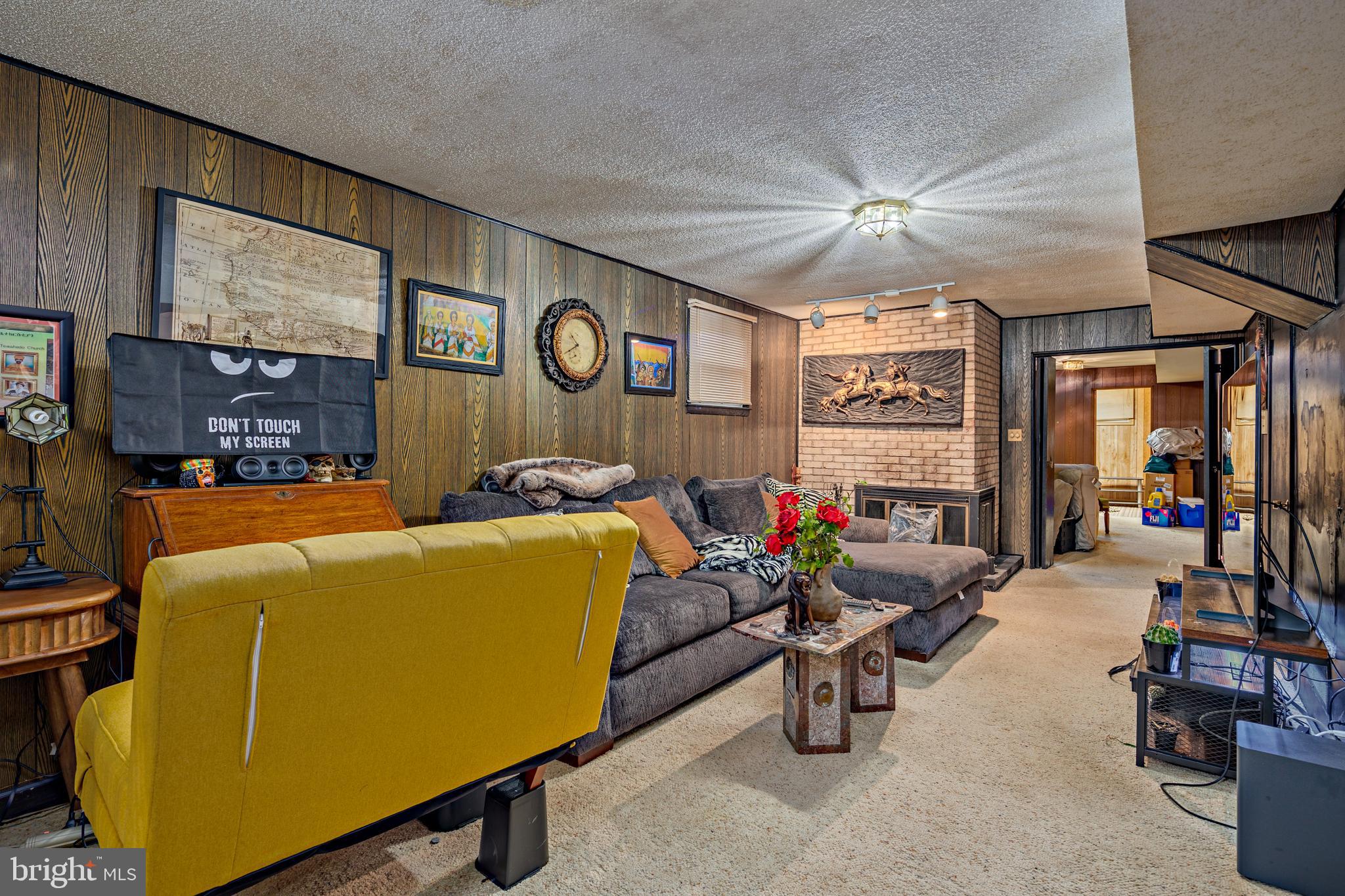 3819 Janbrook Road Randallstown, MD 21133 - Photo 26 of 47 a living room with furniture and a flat screen tv