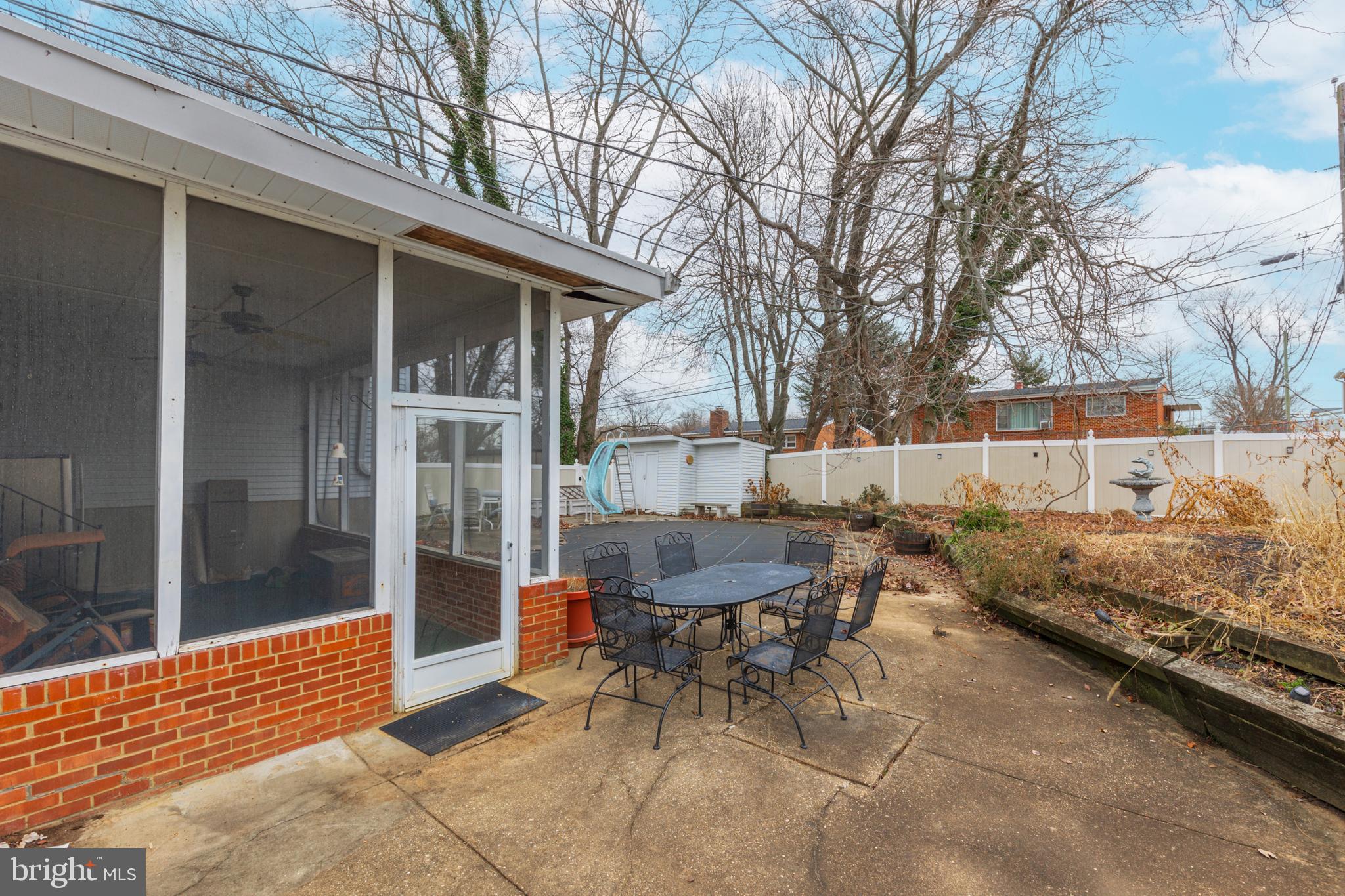 3819 Janbrook Road Randallstown, MD 21133 - Photo 35 of 47 a backyard of a house with table and chairs