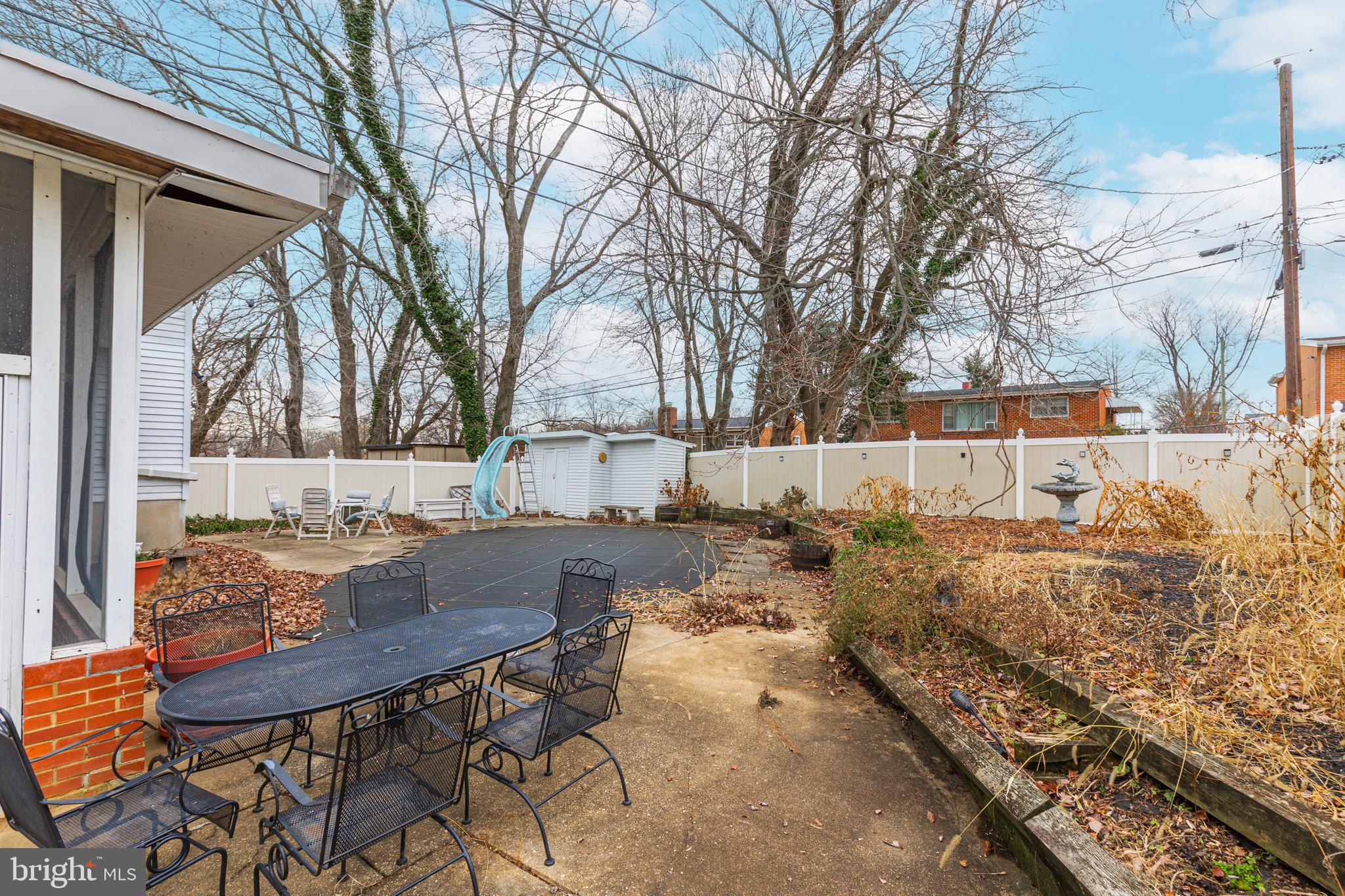 3819 Janbrook Road Randallstown, MD 21133 - Photo 36 of 47 a view of backyard with table and chairs and a barbeque