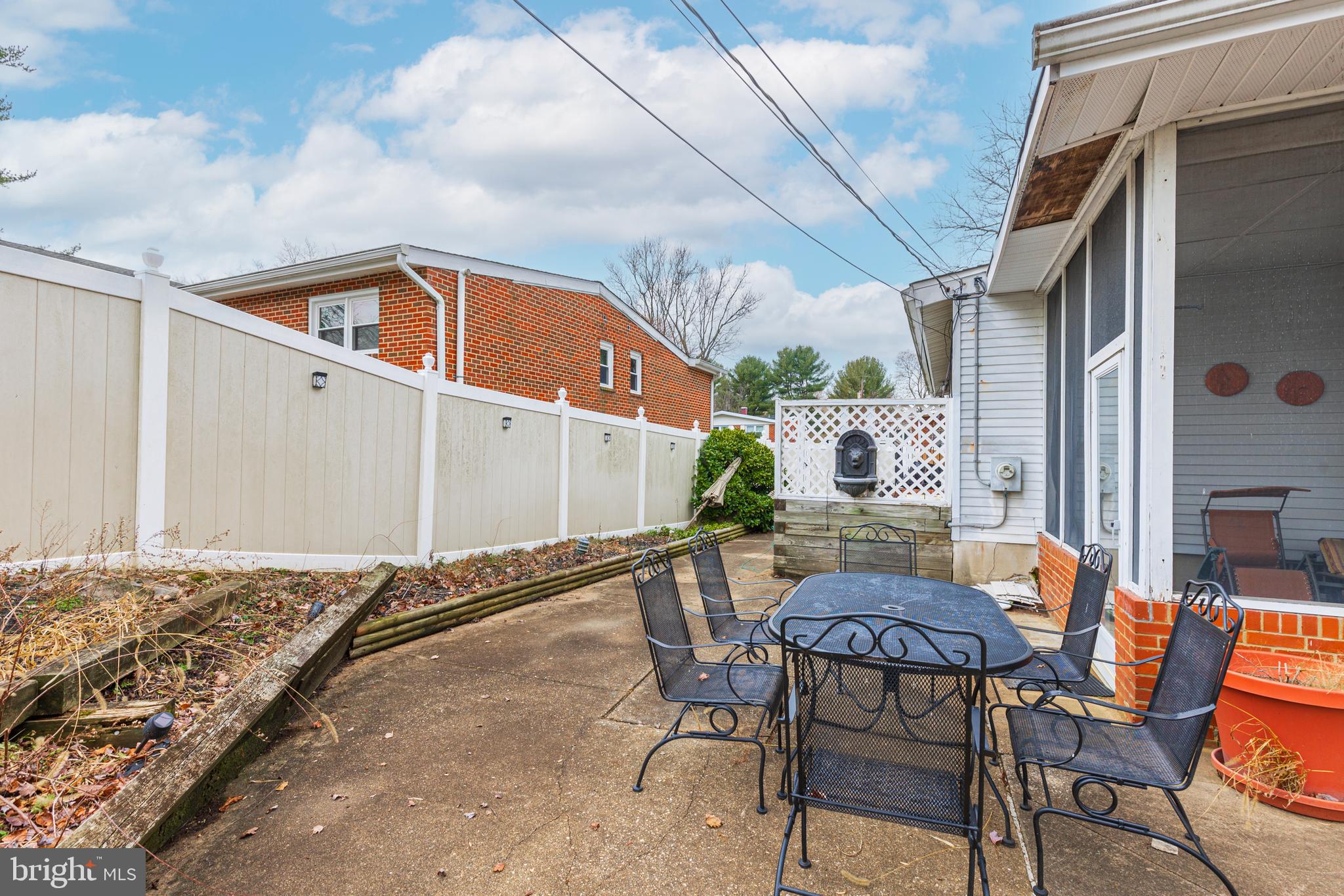 3819 Janbrook Road Randallstown, MD 21133 - Photo 38 of 47 a backyard of a house with table and chairs