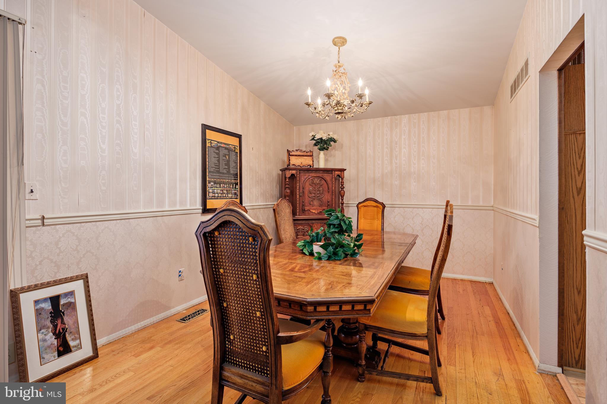 3819 Janbrook Road Randallstown, MD 21133 - Photo 5 of 47 a view of a dining room with furniture and chandelier