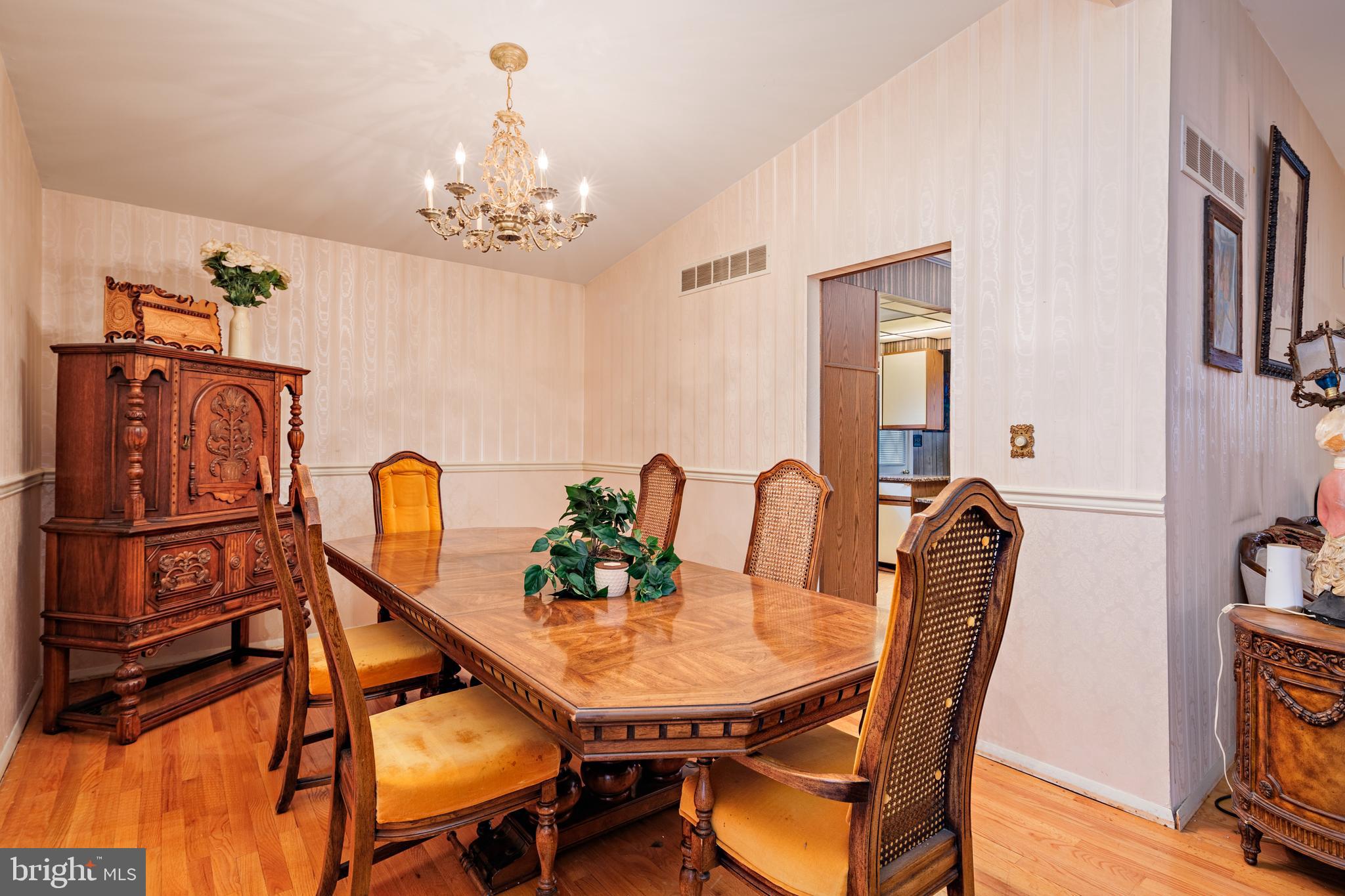 3819 Janbrook Road Randallstown, MD 21133 - Photo 7 of 47 a view of a dining room with furniture and chandelier