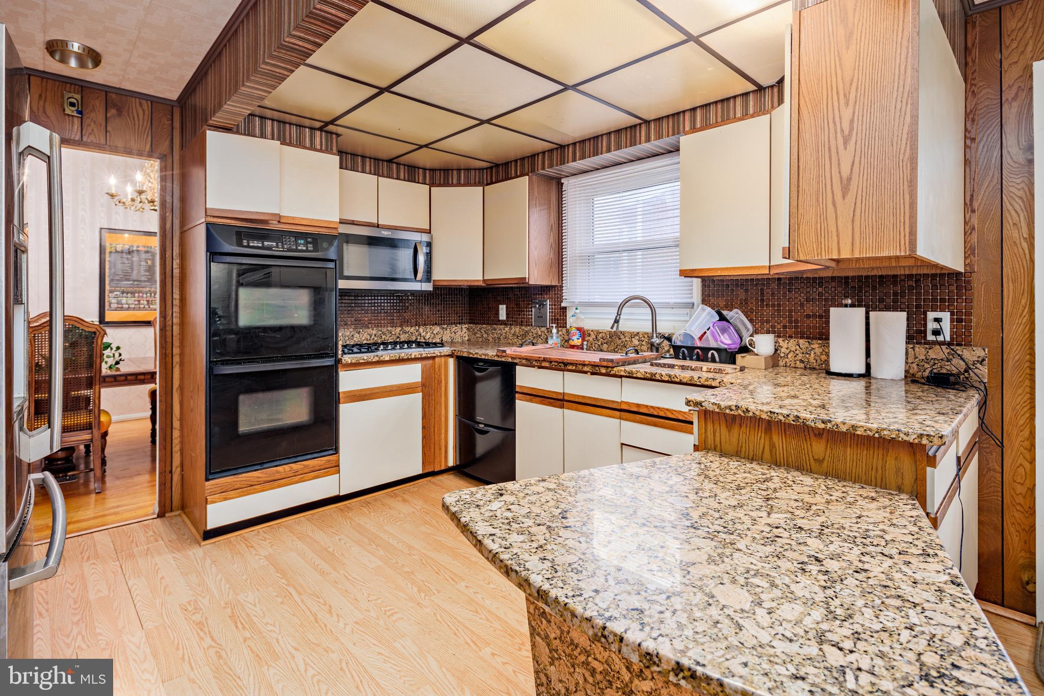 3819 Janbrook Road Randallstown, MD 21133 - Photo 8 of 47 a kitchen with stainless steel appliances granite countertop a stove sink and cabinets