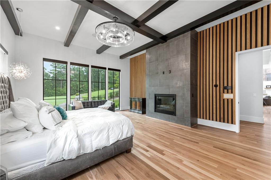 6142 Talmadge Run Acworth, GA 30101 - Photo 44 of 120 a spacious bedroom with a large bed and a large window