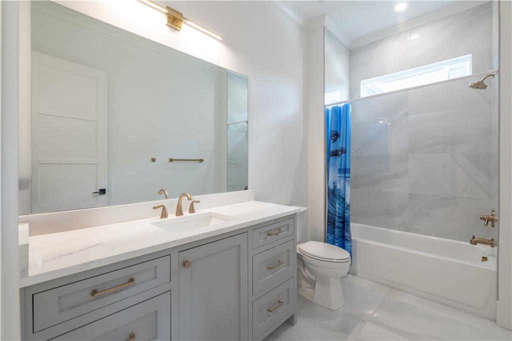 6142 Talmadge Run Acworth, GA 30101 - Photo 54 of 120 a bathroom with a sink a toilet and shower