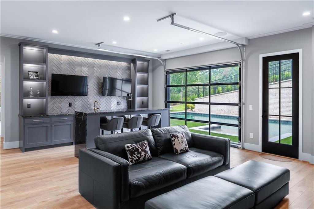 6142 Talmadge Run Acworth, GA 30101 - Photo 71 of 120 a living room with furniture and a flat screen tv