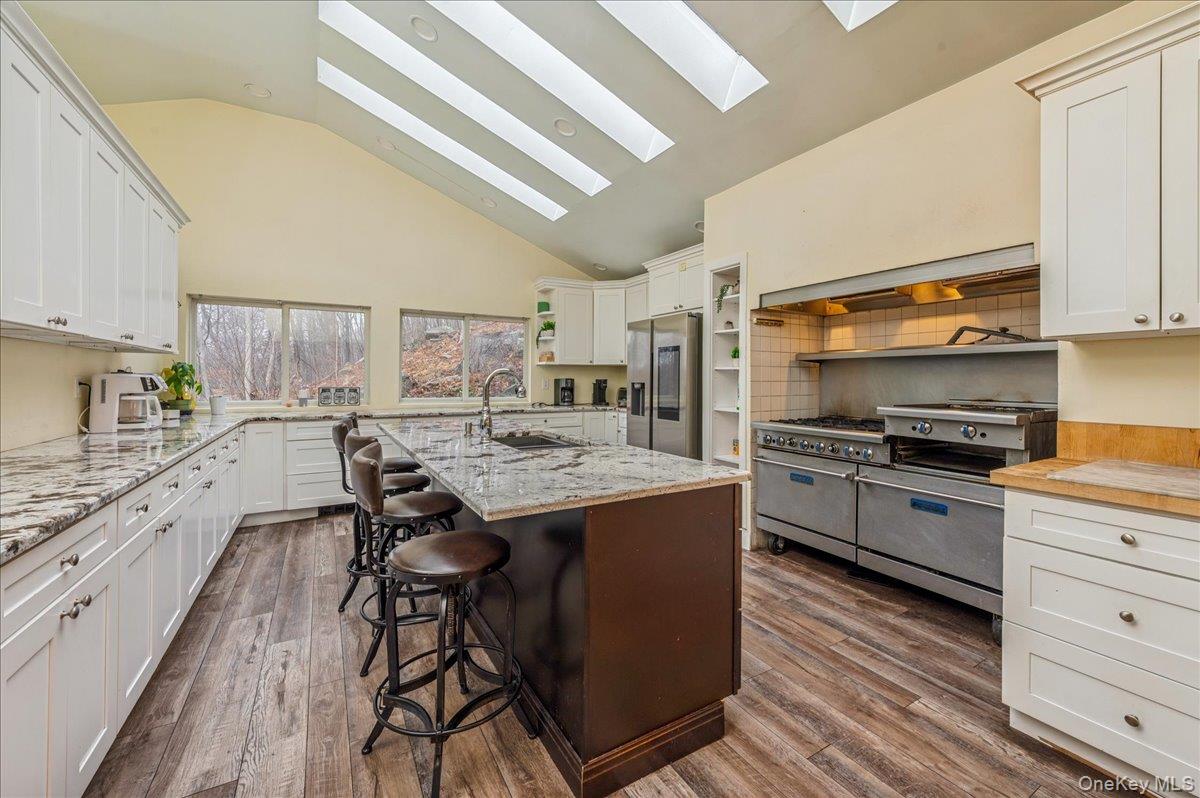 584 Milltown Road Brewster, NY 10509 - Photo 12 of 37 a kitchen with granite countertop a sink appliances counter top space and cabinets
