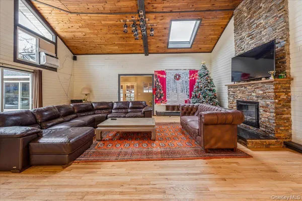 a living room with furniture fireplace and flat screen tv