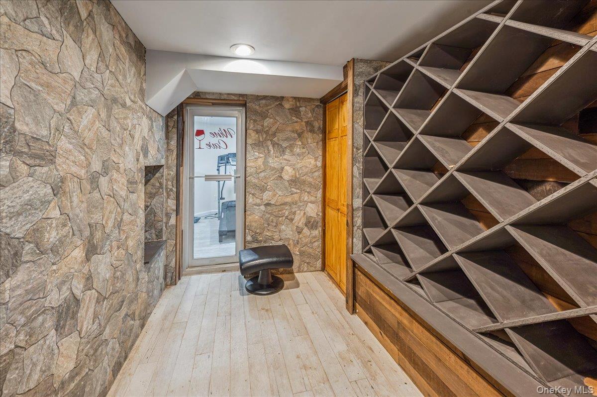 584 Milltown Road Brewster, NY 10509 - Photo 19 of 37 a view of walk in closet with clothes and shoes