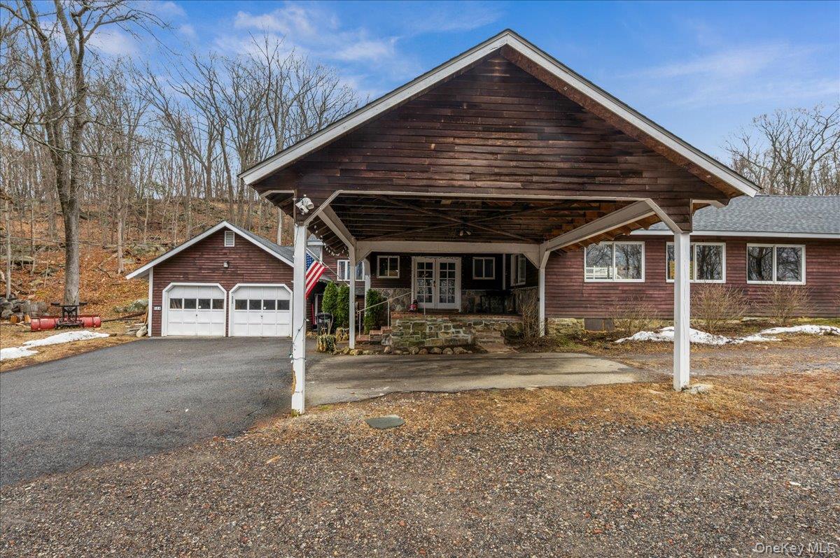 584 Milltown Road Brewster, NY 10509 - Photo 2 of 37 a front view of a house with garden