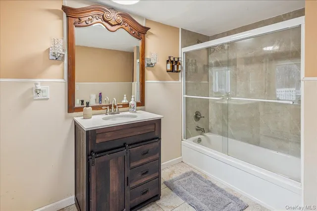 a bathroom with a sink a vanity and a mirror