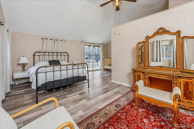 a living room with a bed furniture and a window