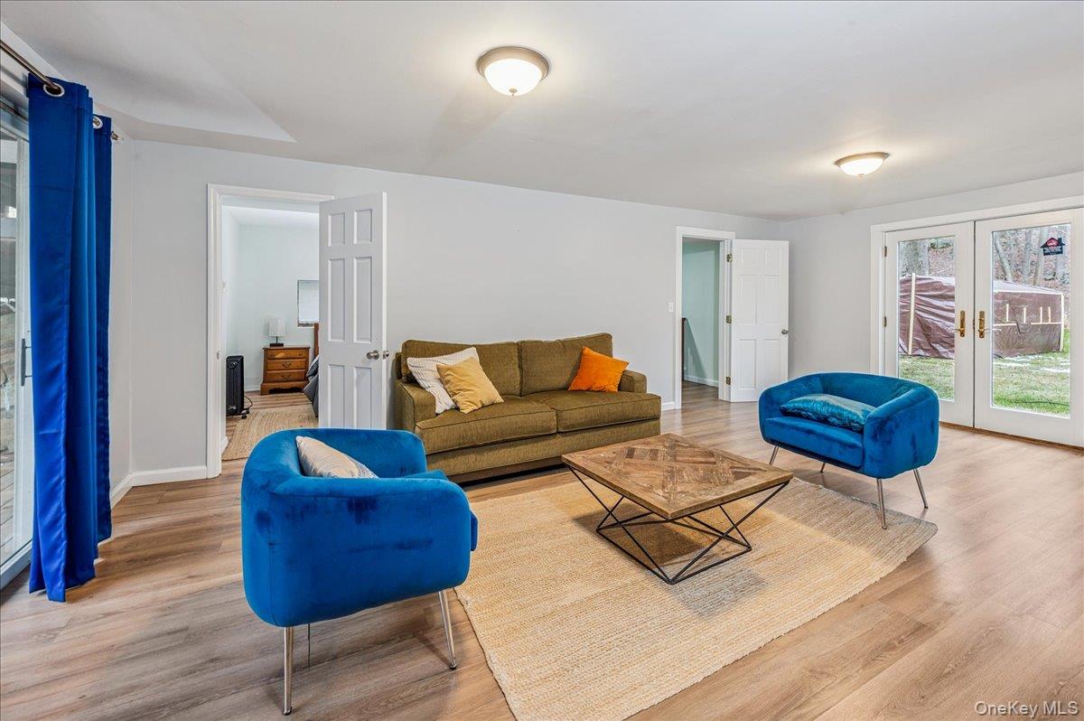584 Milltown Road Brewster, NY 10509 - Photo 26 of 37 a living room with furniture and a wooden floor