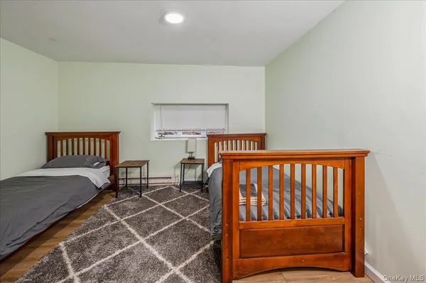 a bedroom with furniture and a window