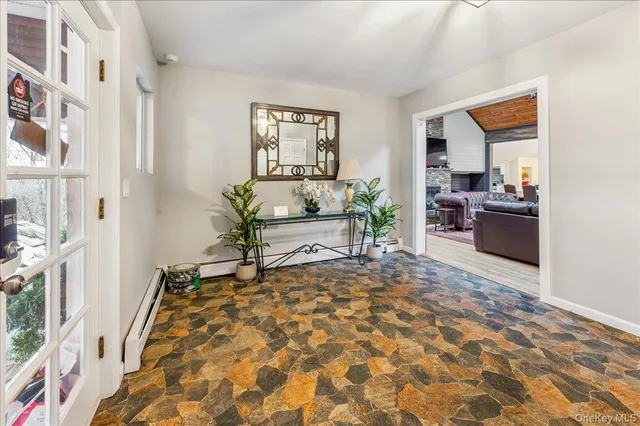 a living room with furniture and a rug