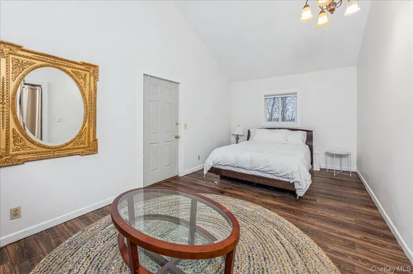 a bedroom with a bed and a table in it