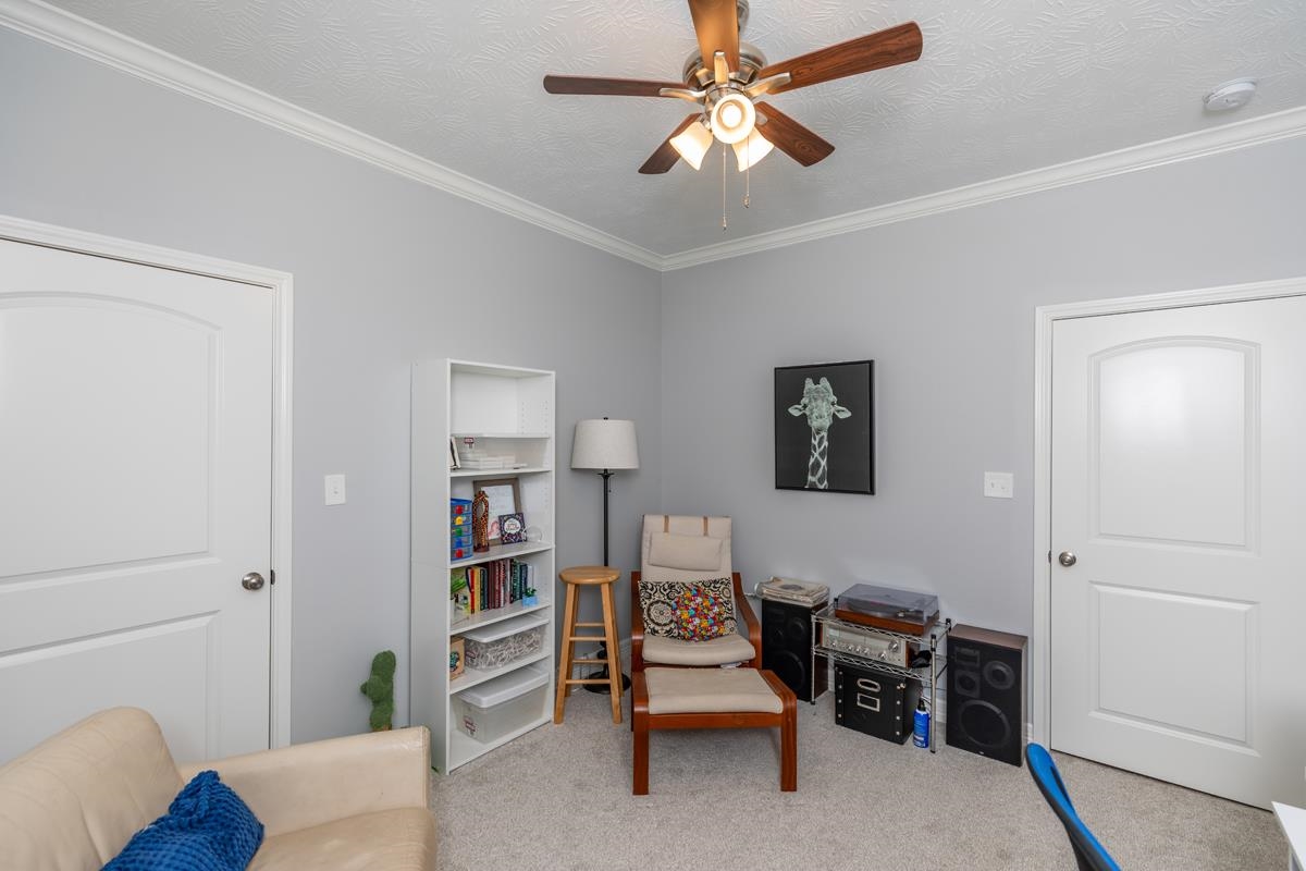 314 Long Leaf Street Silsbee, TX 77656 - Photo 24 of 31 a view of a livingroom with furniture and a ceiling fan