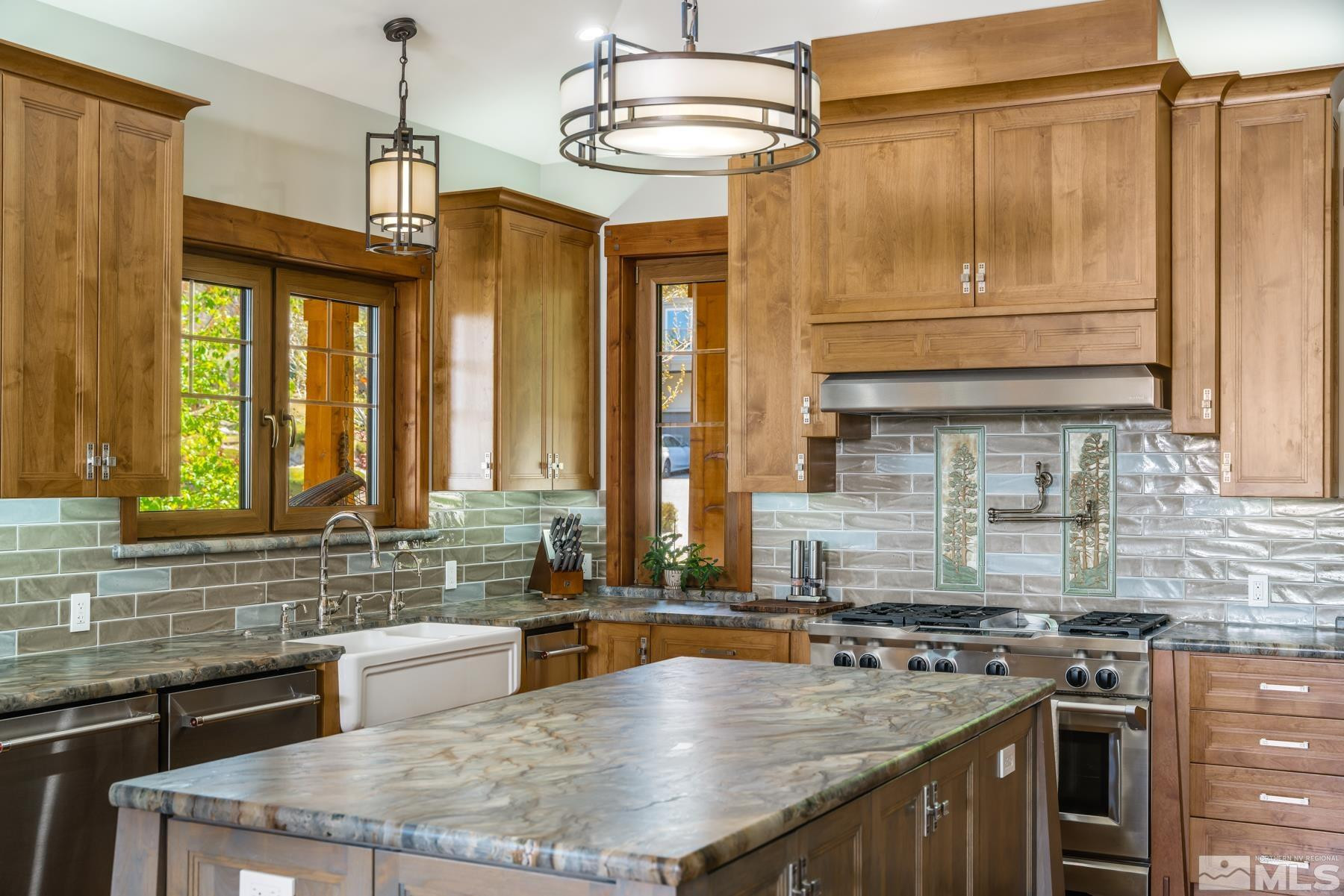 2785 West Lakeridge Reno, NV 89519 - Photo 11 of 40 a kitchen with stainless steel appliances granite countertop a sink a stove and a wooden cabinets