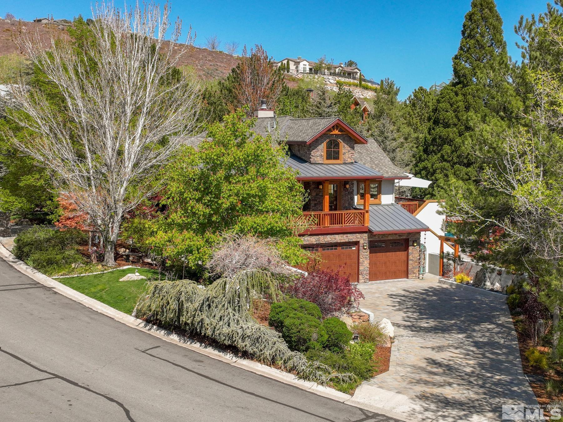 2785 West Lakeridge Reno, NV 89519 - Photo 2 of 40 a front view of a house with a yard