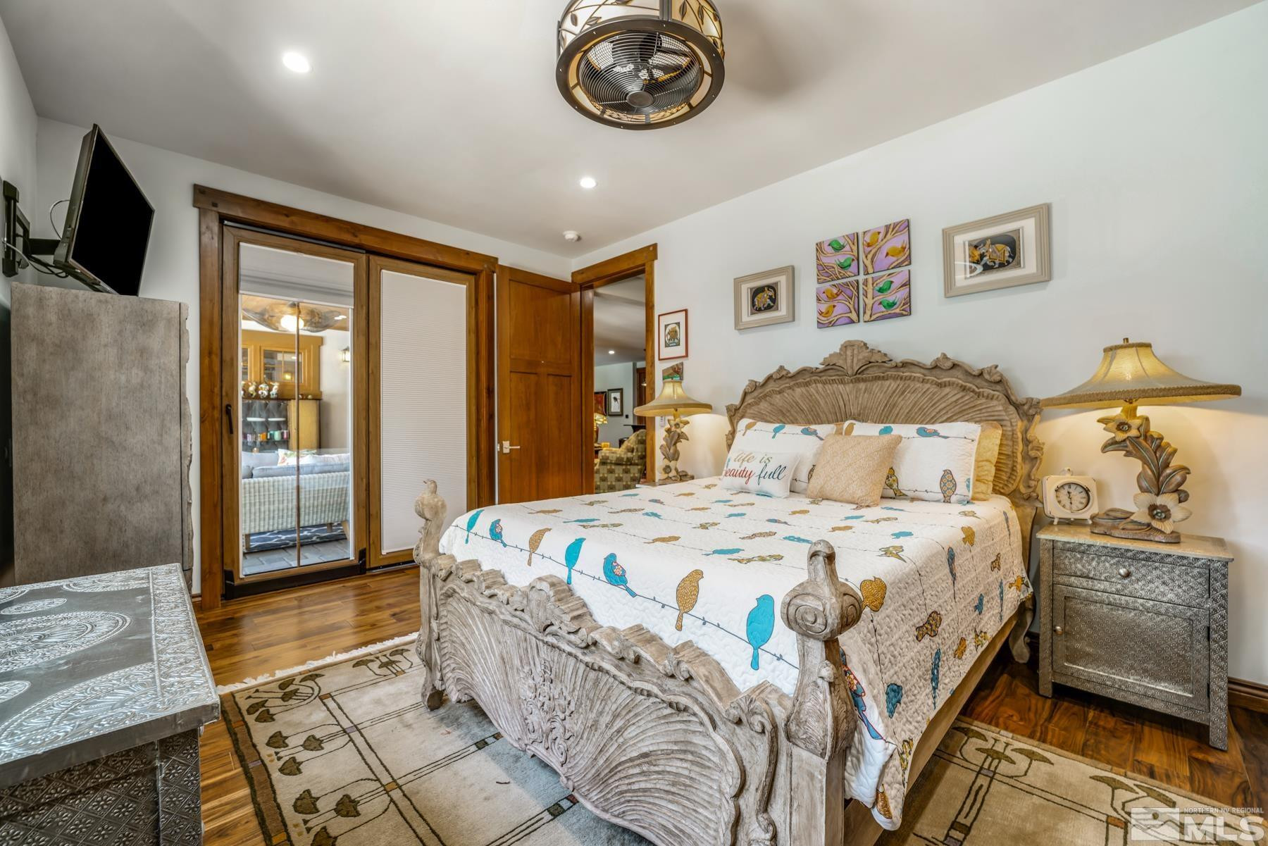 2785 West Lakeridge Reno, NV 89519 - Photo 23 of 40 a bedroom with a bed a dresser and next to a window