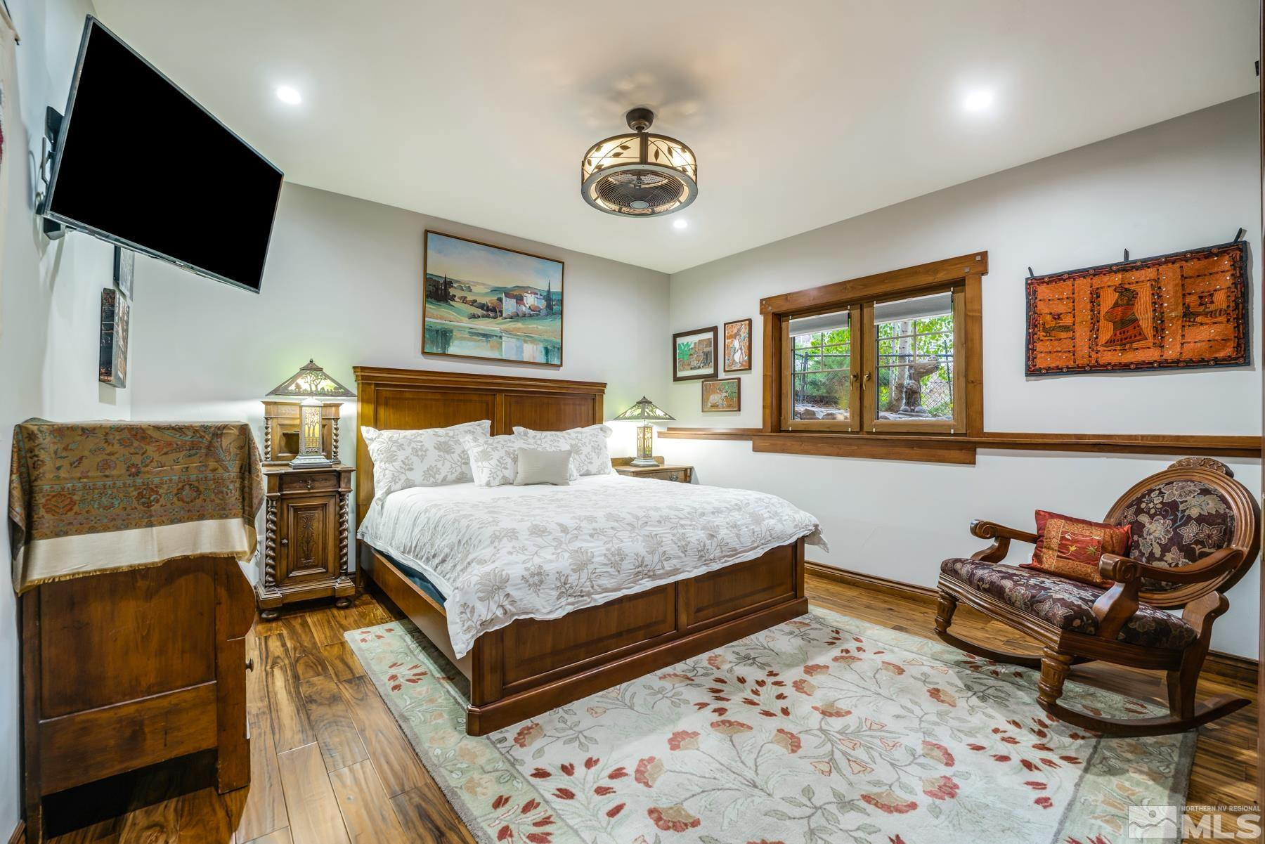 2785 West Lakeridge Reno, NV 89519 - Photo 25 of 40 a bedroom with a bed and wooden floor