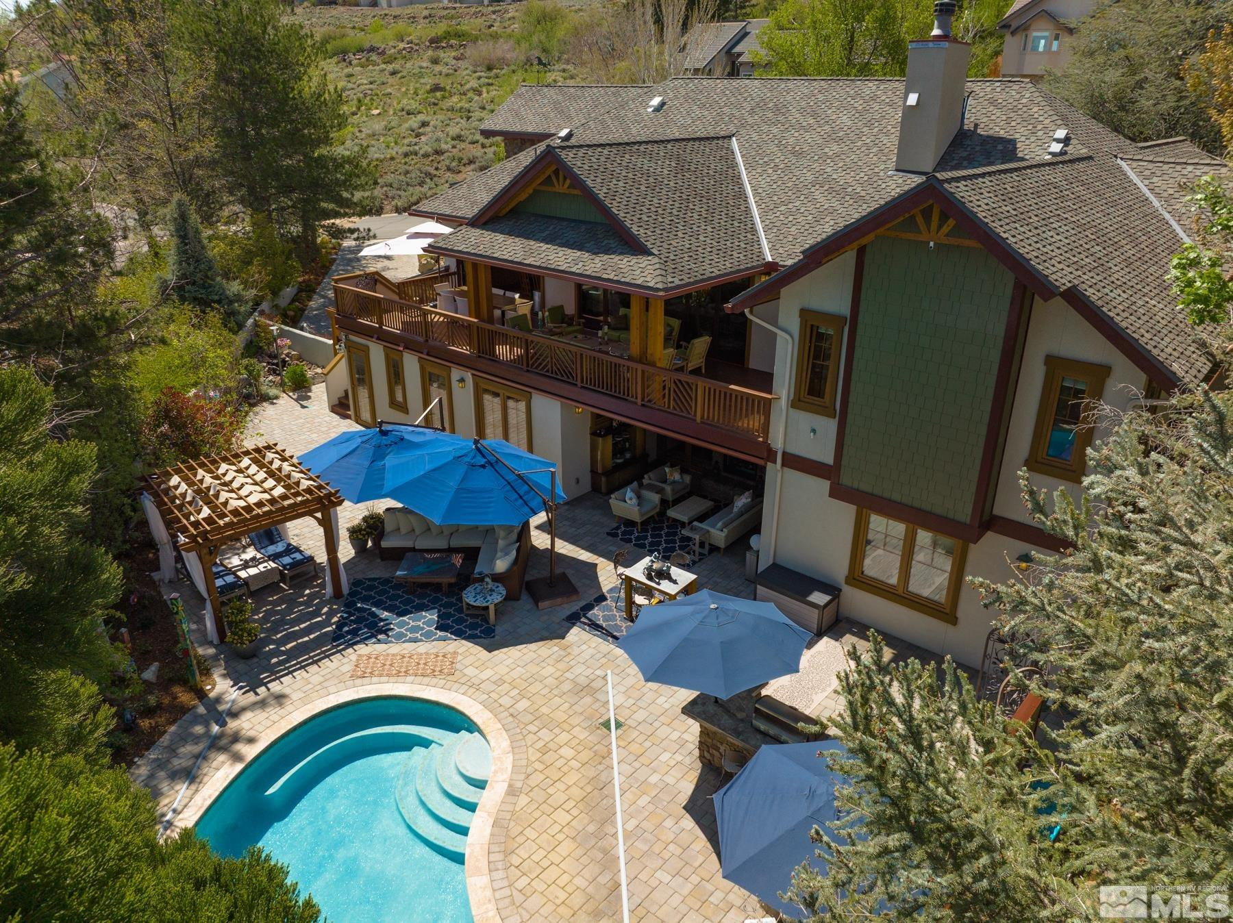 2785 West Lakeridge Reno, NV 89519 - Photo 8 of 40 an aerial view of a house with swimming pool and outdoor seating
