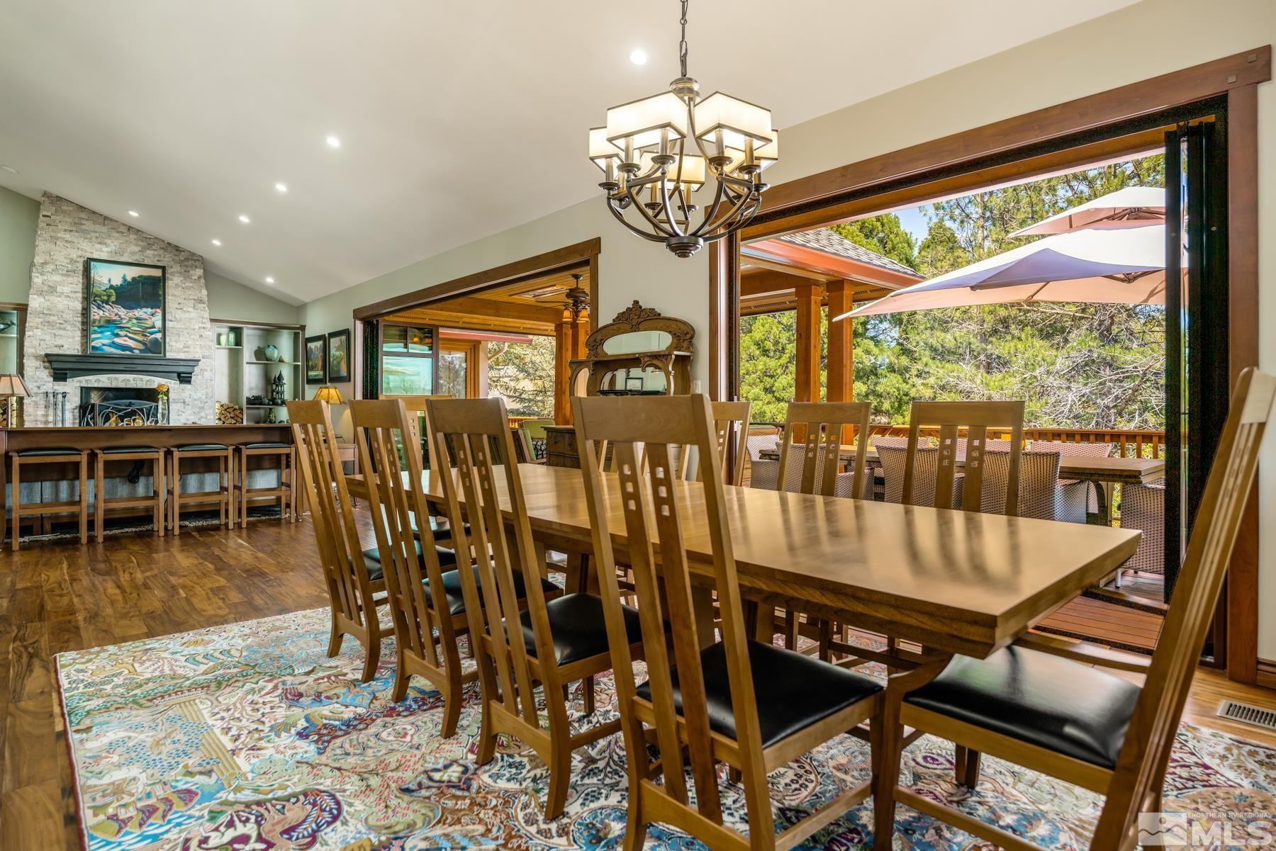 2785 West Lakeridge Reno, NV 89519 - Photo 10 of 40 a view of a dining room with furniture wooden floor and chandelier