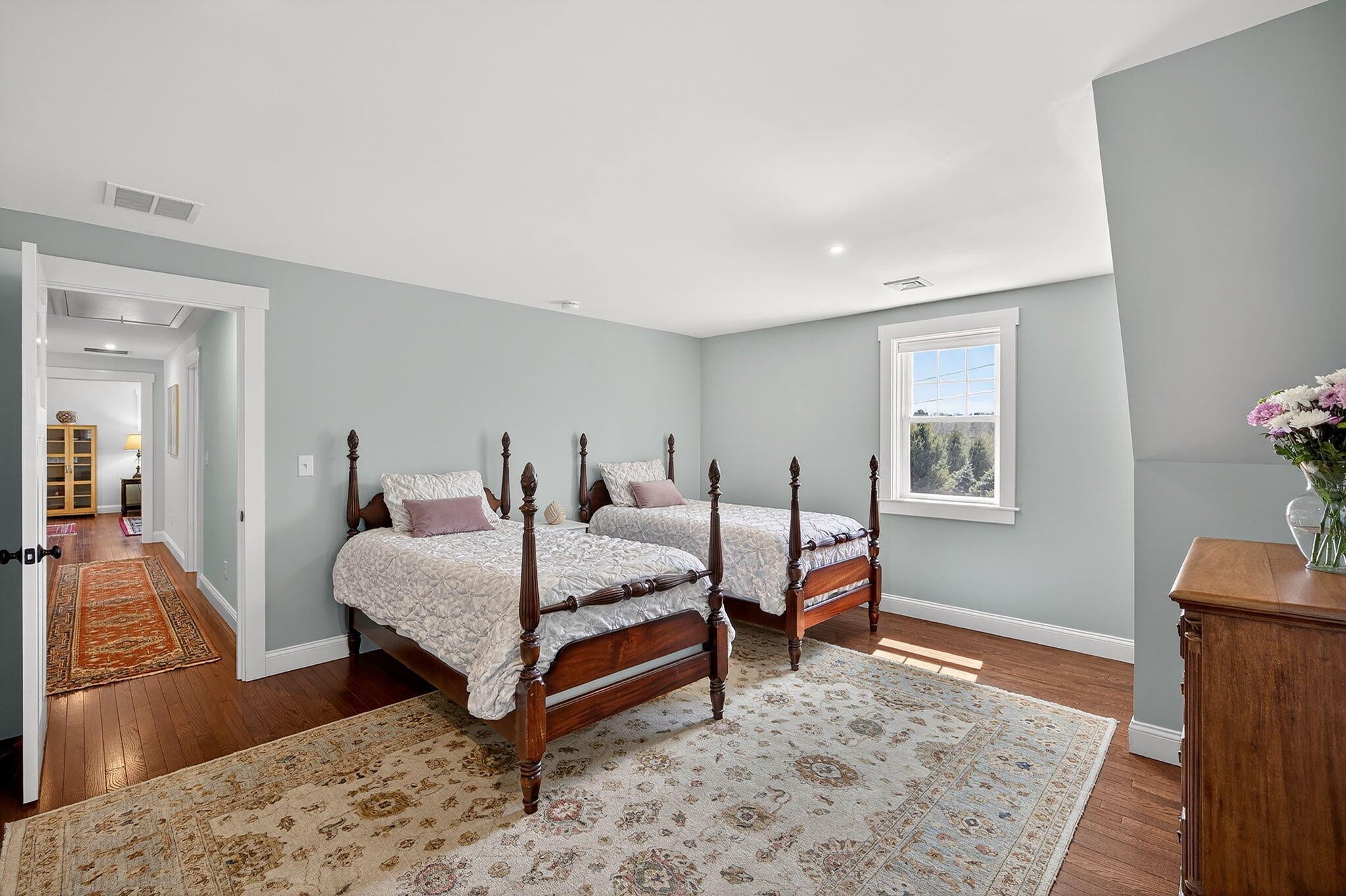 176 Bumps River Road Osterville, MA 02655 - Photo 35 of 54 a bedroom with a bed and wooden floor