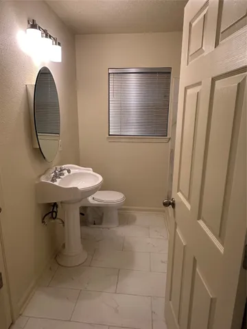 a bathroom with a bathtub and toilet